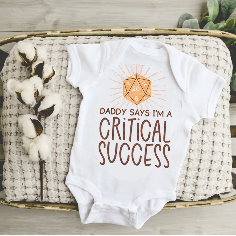 Daddy Says I'm A Critical Success Baby Bodysuit